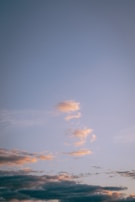 A serene moment from a popular anime, featuring soft lighting and pastel colors with subtle neon highlights.