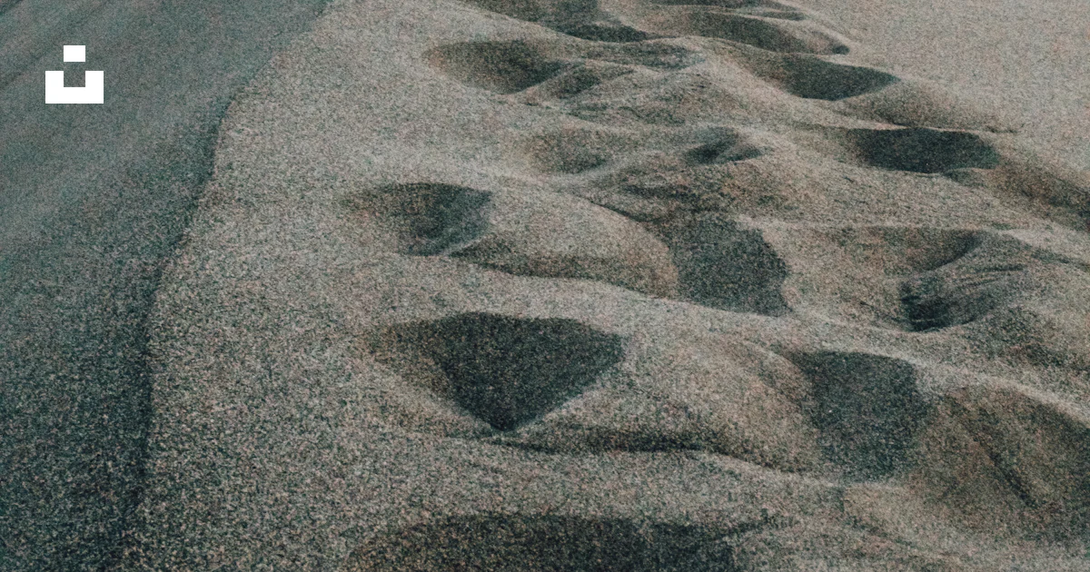 A road that has some footprints in the sand photo – Free Sand Image on ...