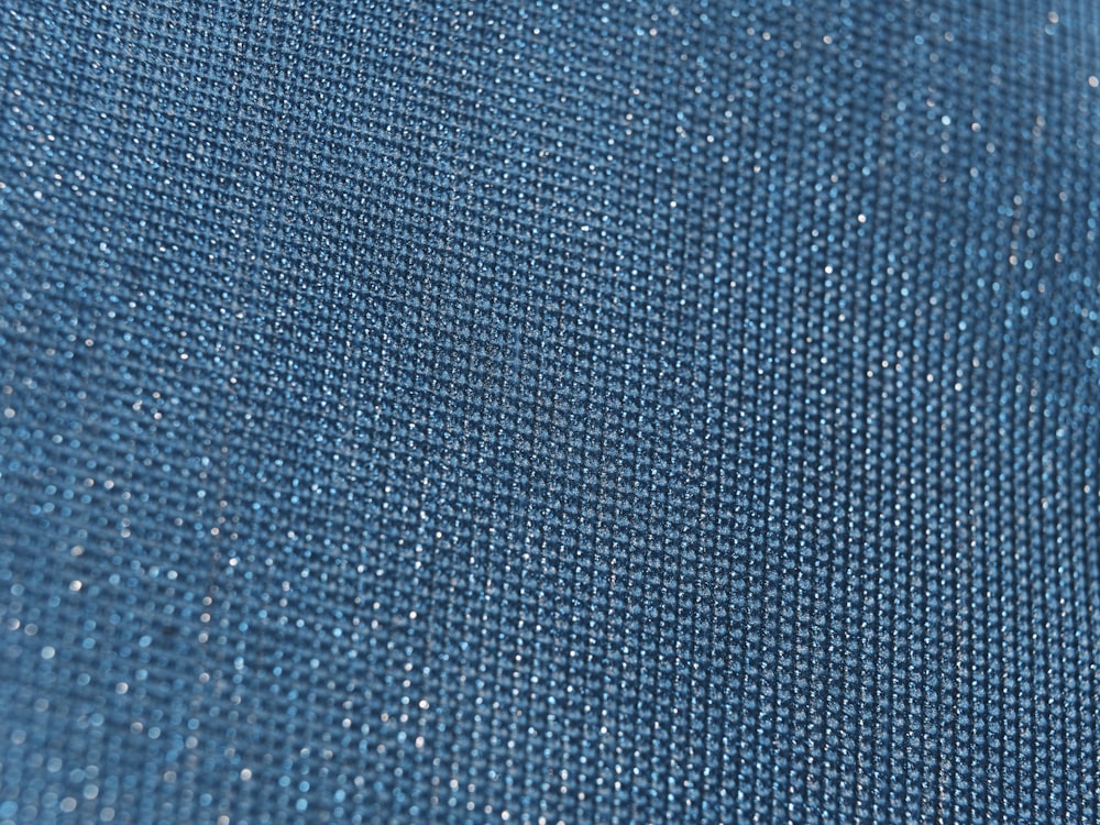 a close up of a blue fabric texture