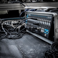 a bunch of wires are plugged into a machine