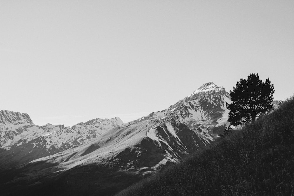 a black and white photo of a mountain range