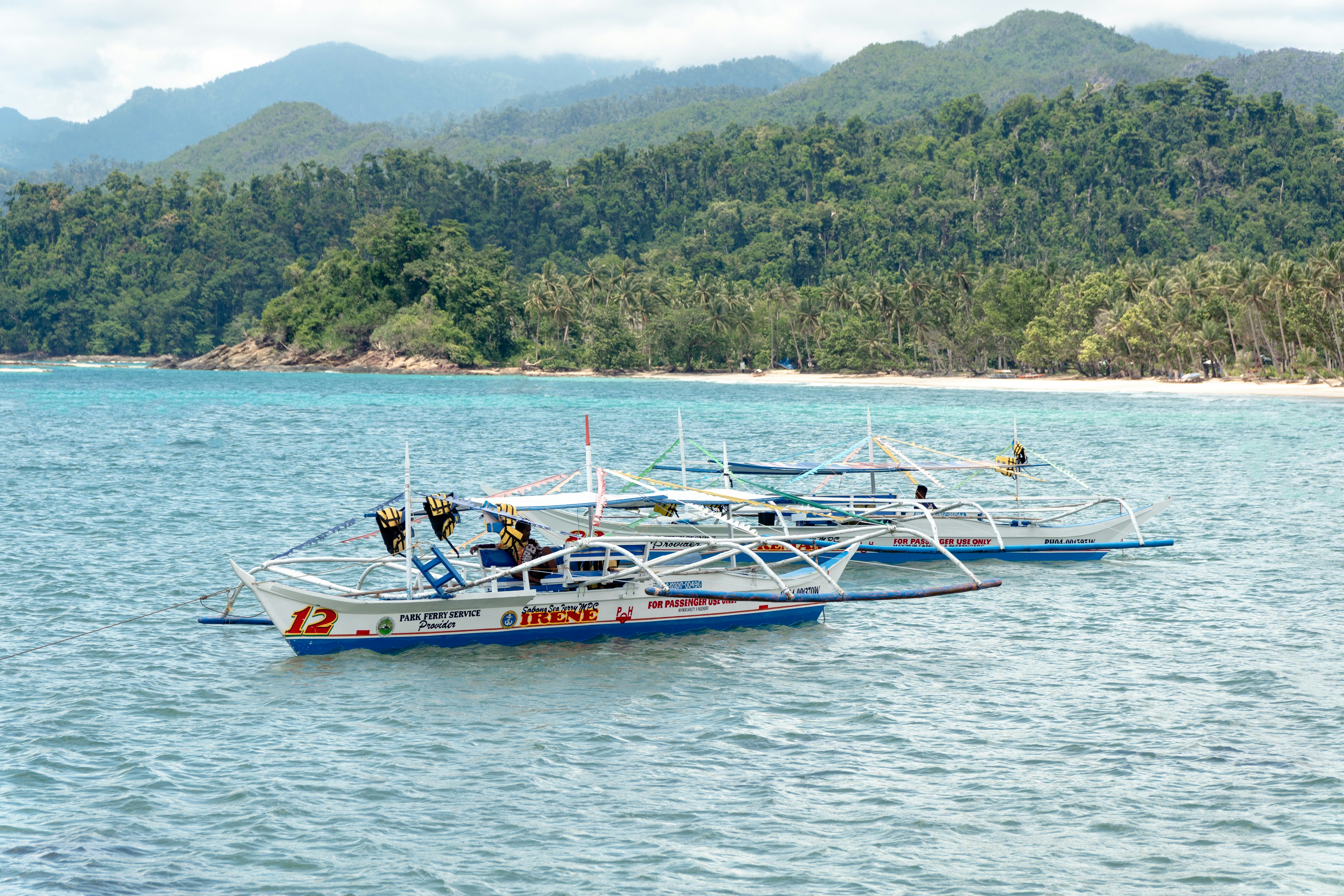 a couple of boats that are in the water, 