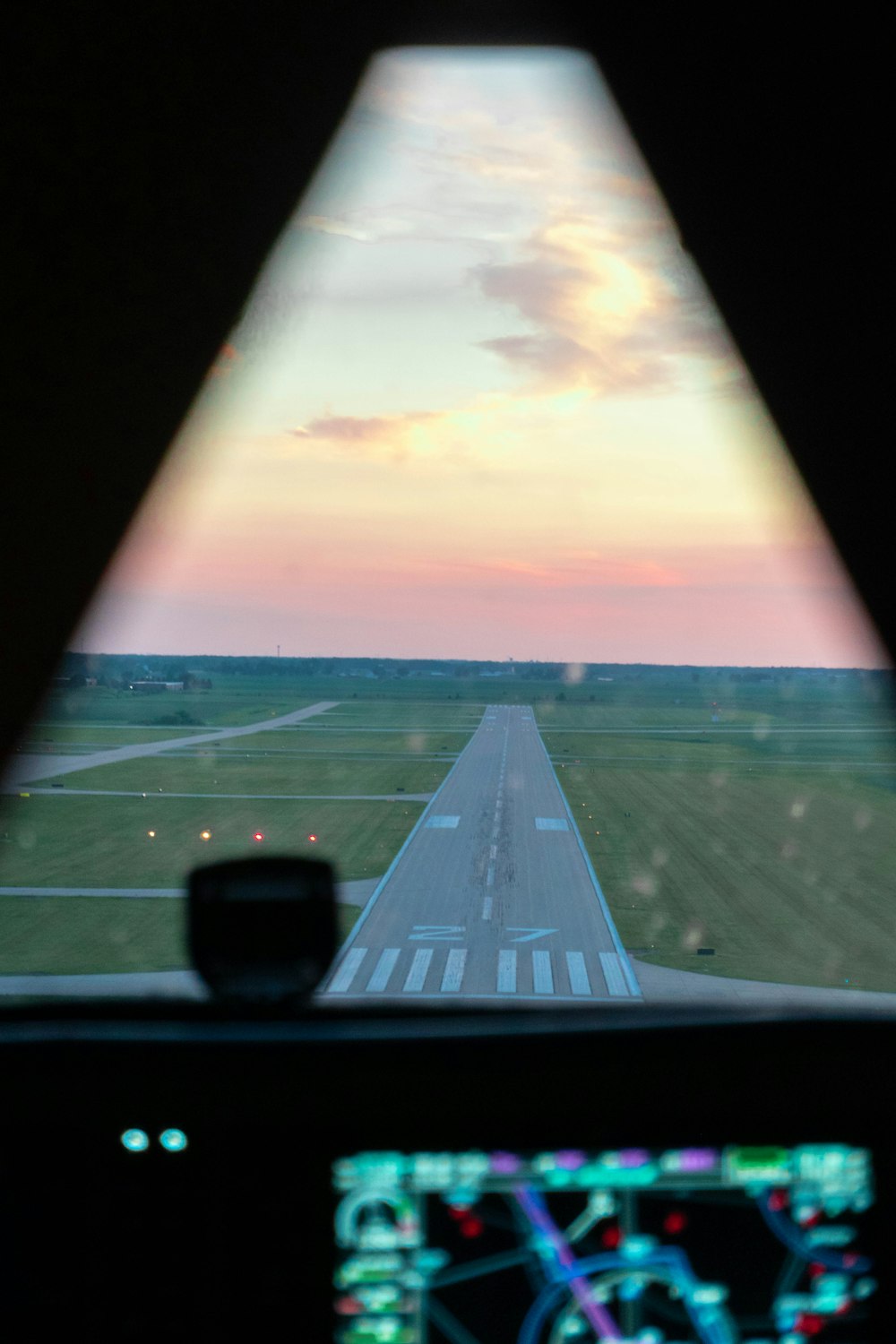 a view of a runway from inside a plane