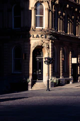 Before and after shots of a vintage building's restored entrance.