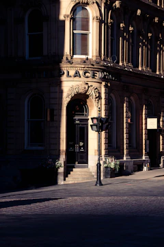 Before and after shots of a vintage building's restored entrance.