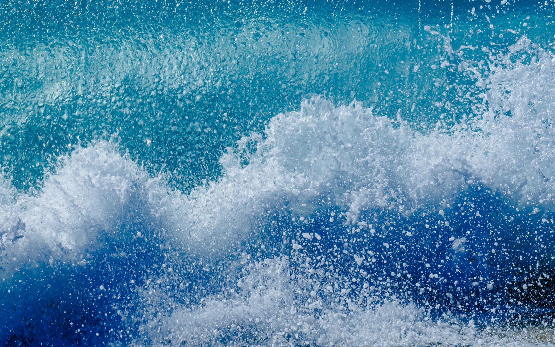 a person riding a surfboard on a wave in the ocean