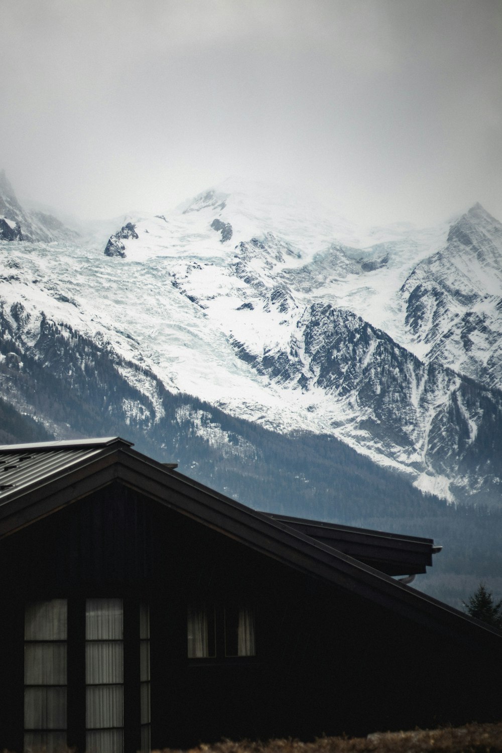 a snow covered mountain range in the distance