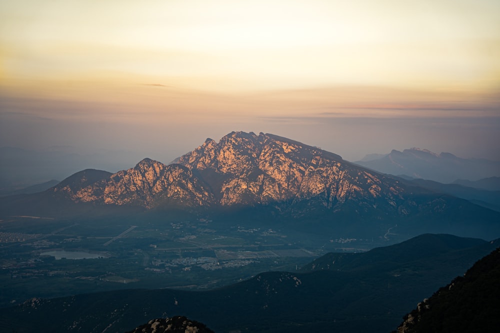 a view of a mountain range at sunset