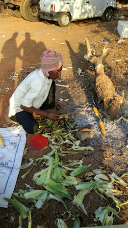 Women artisans carefully roasting agave hearts over an open fire in Michoacán.