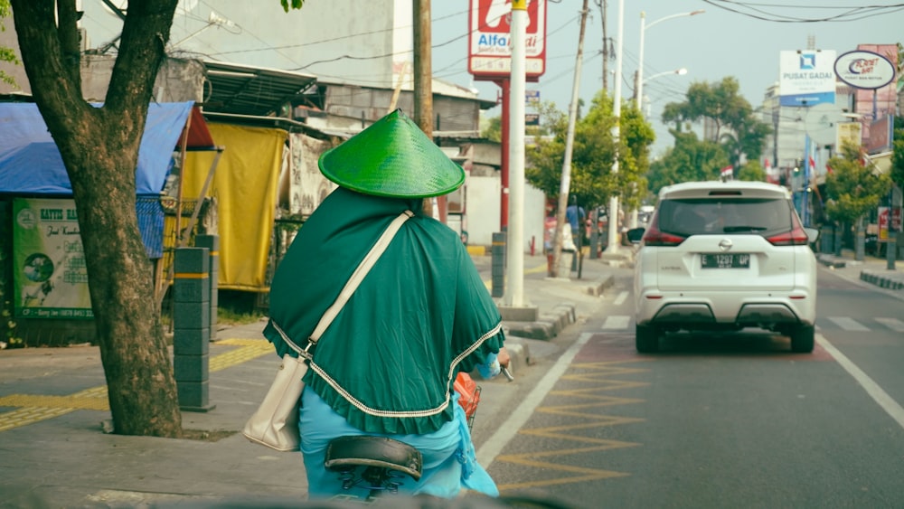 a person riding a motorcycle down a street