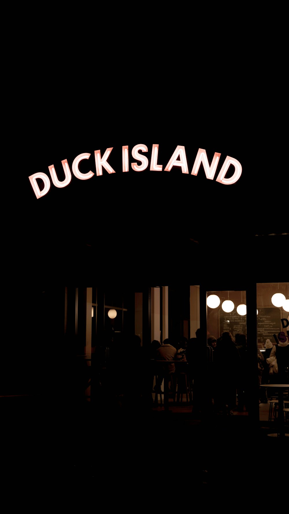 a restaurant with a sign that says duck island