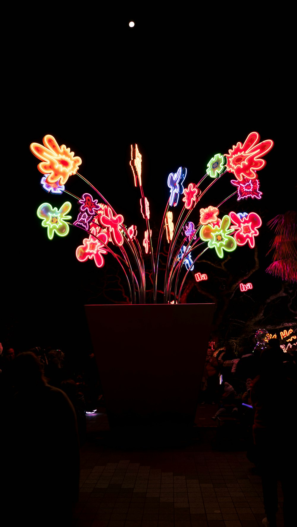 a large pot filled with lots of colorful lights