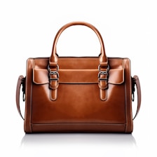 A brown leather handbag with a structured rectangular shape is prominently displayed. It features two handles and buckle accents on the front, highlighting a classic and elegant design. The stitching is visible along the edges, adding to the refined appearance.