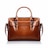 A brown leather handbag with a structured rectangular shape is prominently displayed. It features two handles and buckle accents on the front, highlighting a classic and elegant design. The stitching is visible along the edges, adding to the refined appearance.