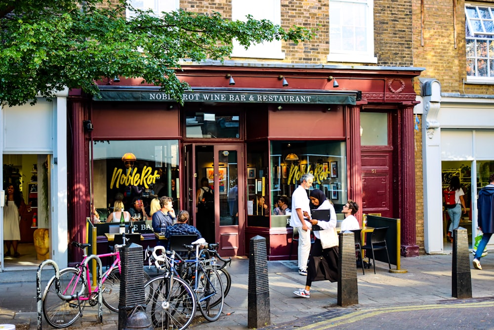 a group of people standing outside of a store