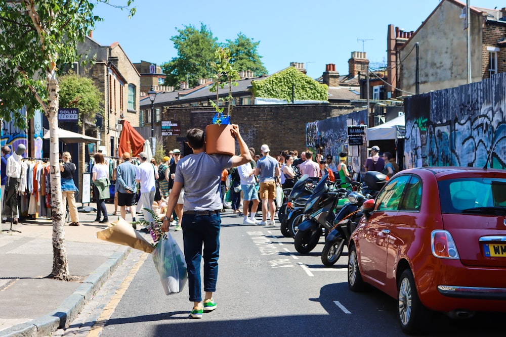 a person walking down a street with a skateboard