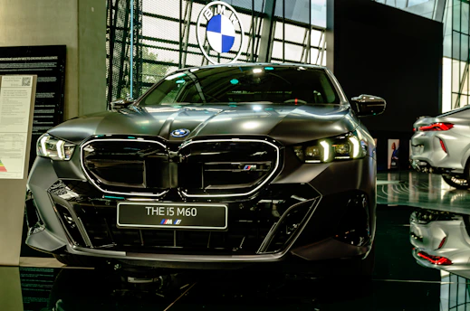 A sleek second-hand car displayed with a price tag highlighting affordability in a stylish showroom.