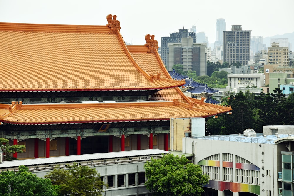 a tall building with a golden roof in a city