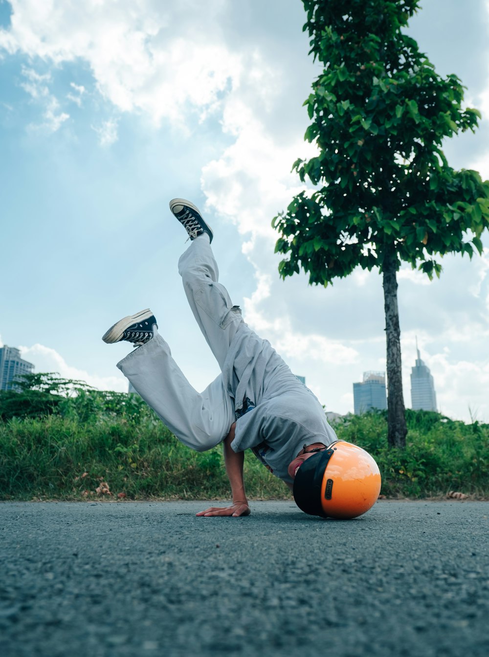 a man is doing a handstand on the street