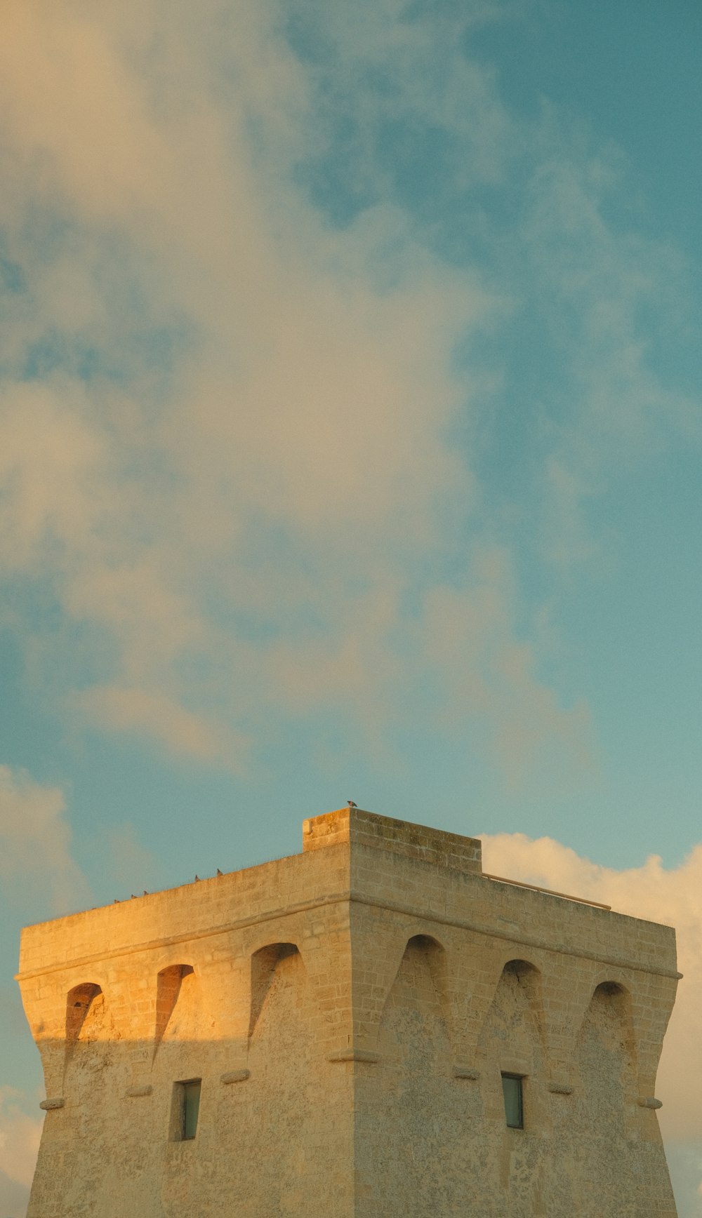 a tall building with a clock on the top of it