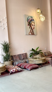 A cozy living room featuring Indian handicraft cushions and wall hangings