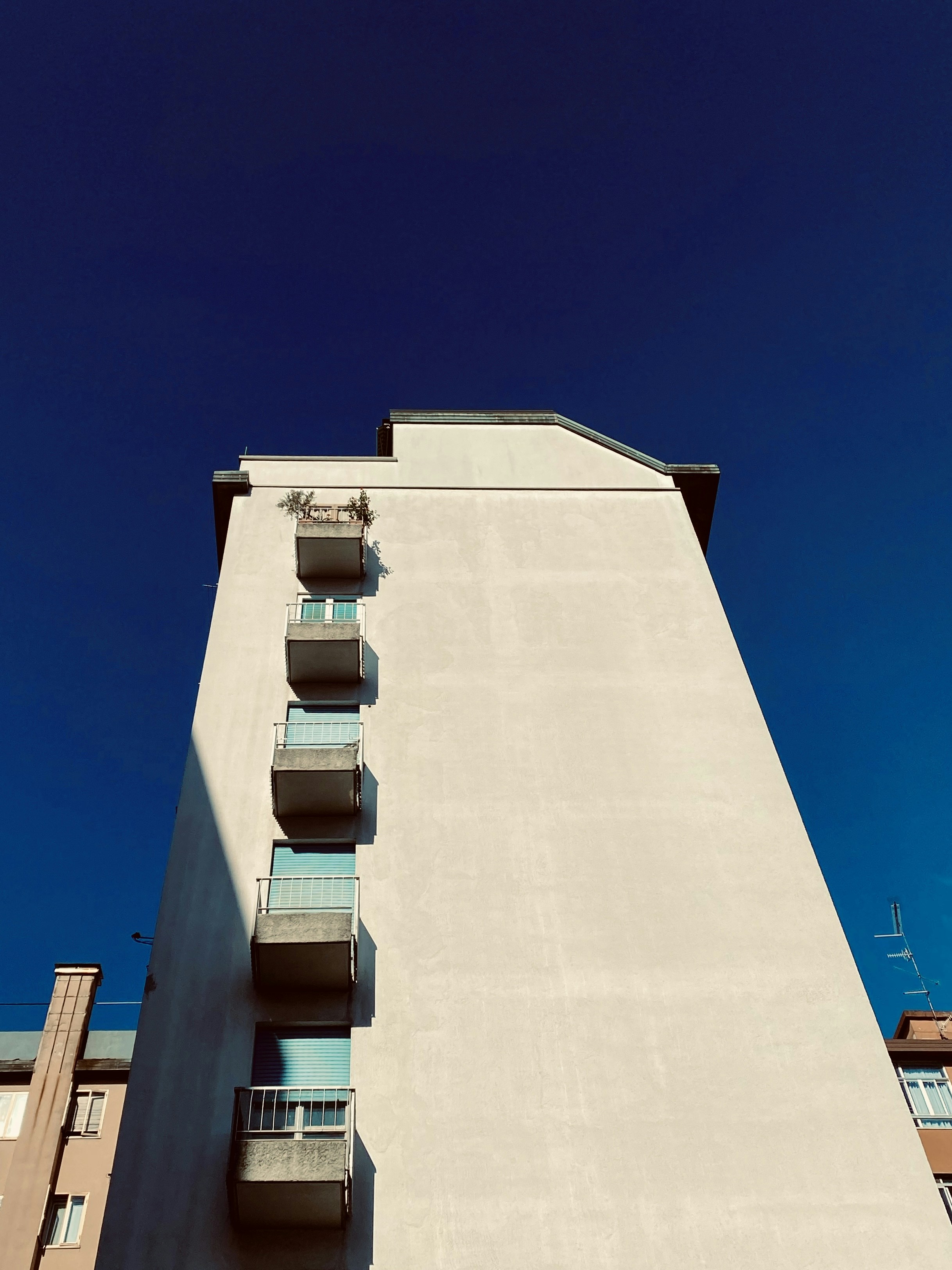 a tall building with balconies and balconies on the balconies