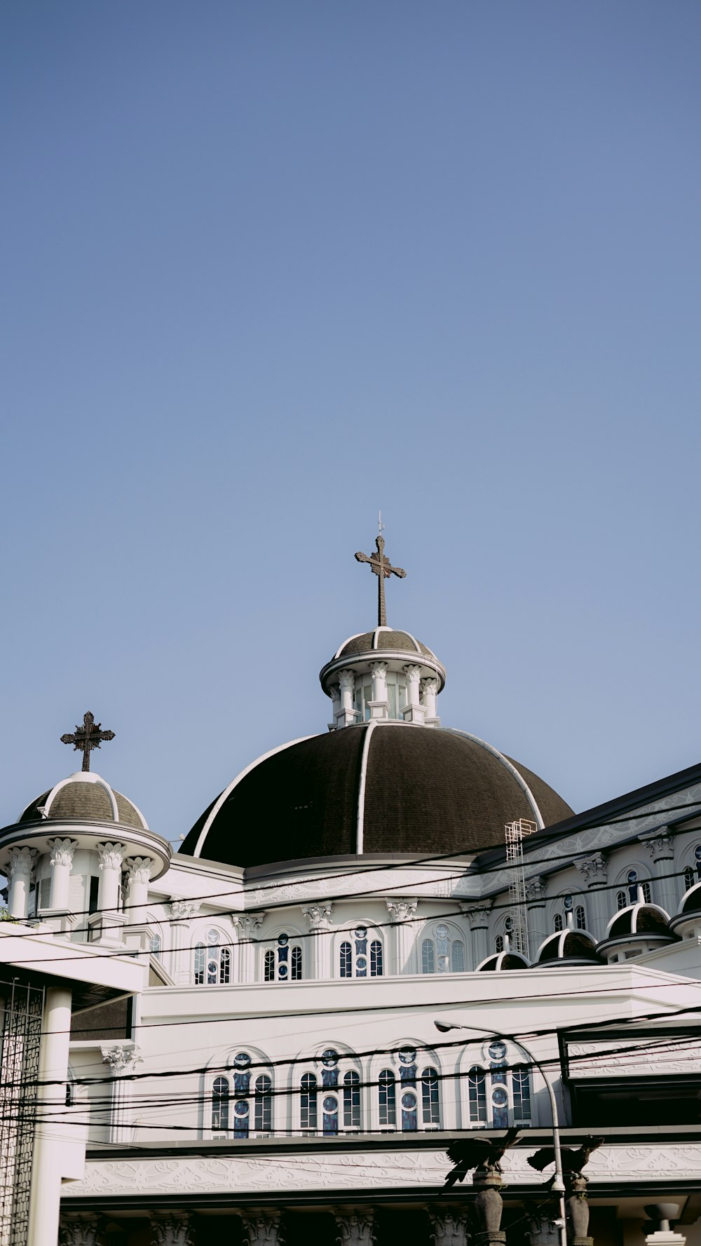 a large building with a cross on top of it