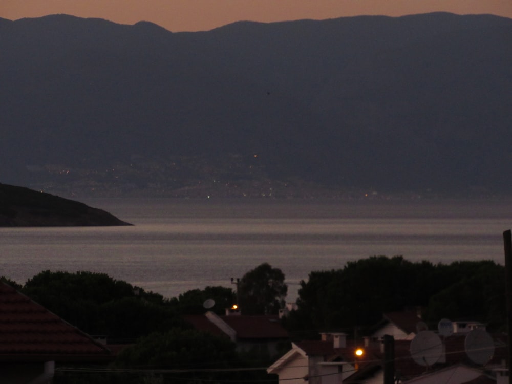 a view of a body of water with mountains in the background