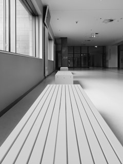 Calm, clinical hallway with natural light highlighting the minimalist design