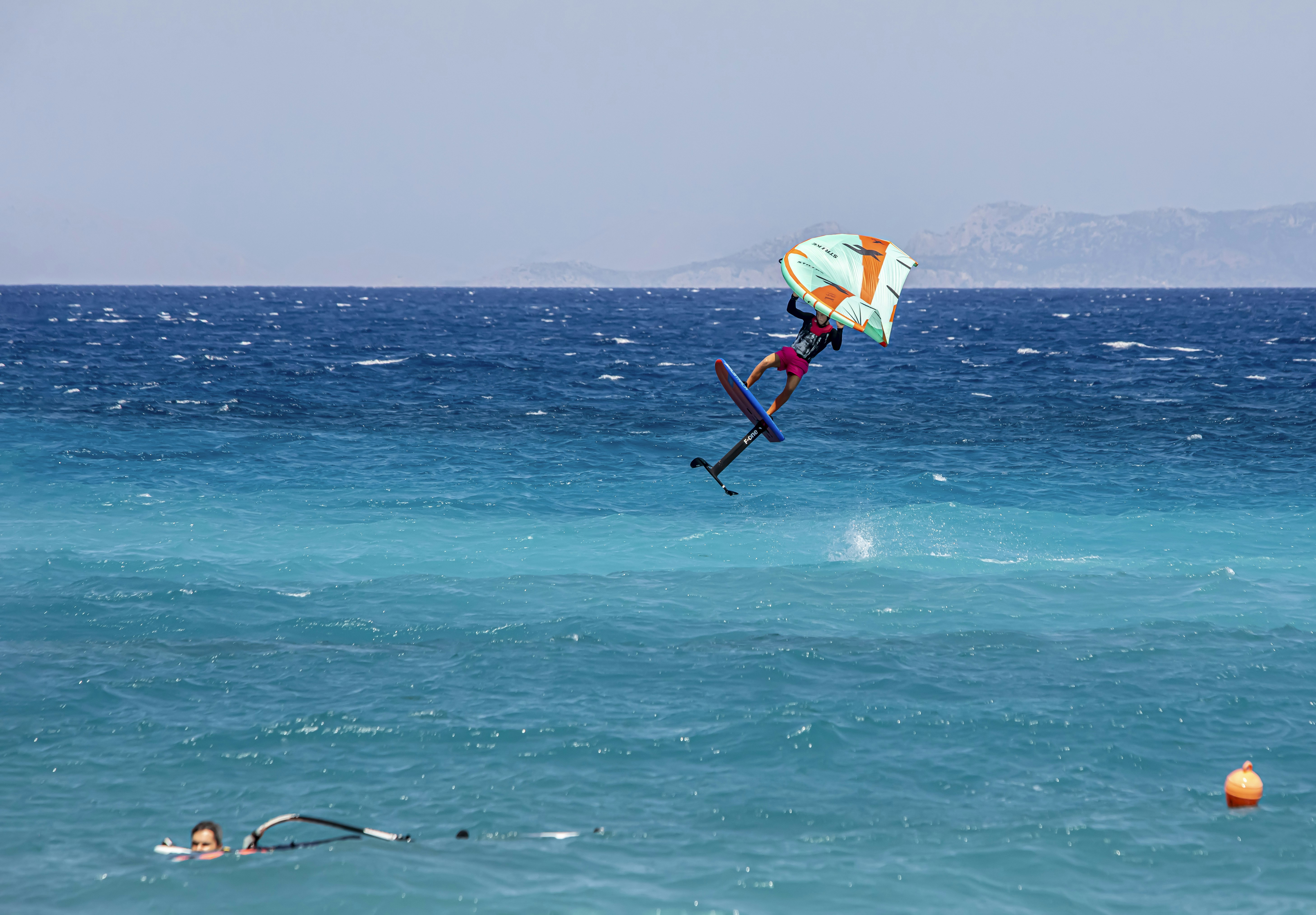a person on a surfboard in the water