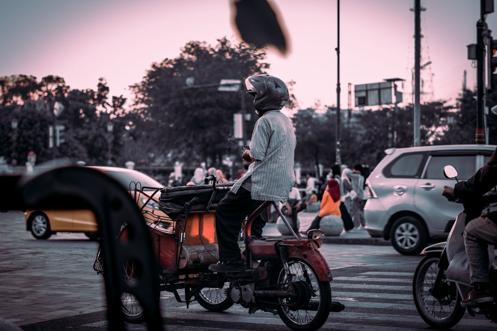 a person riding a bike with a basket on the back of it