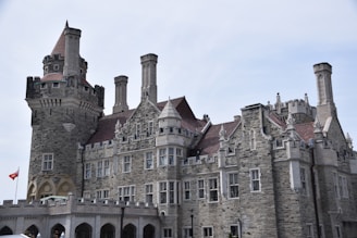 a large castle like building with a flag flying in front of it