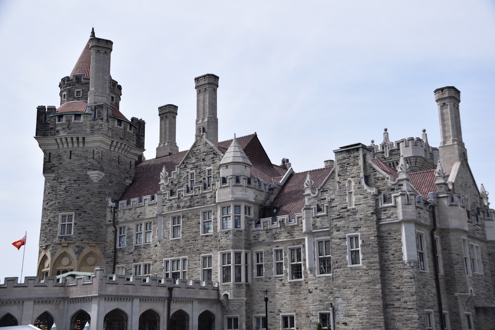 a large castle like building with a flag flying in front of it