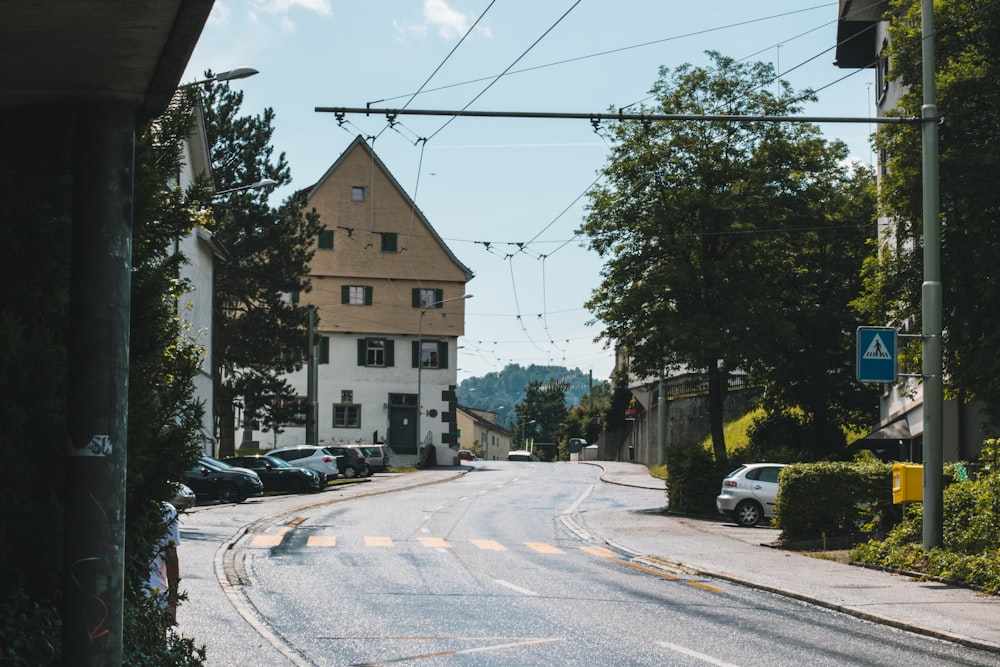 a street with cars parked on the side of it