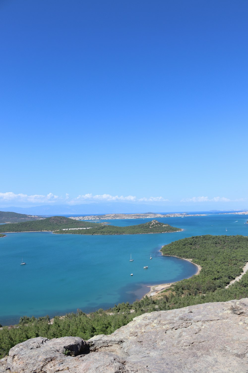 a view of a body of water from a hill