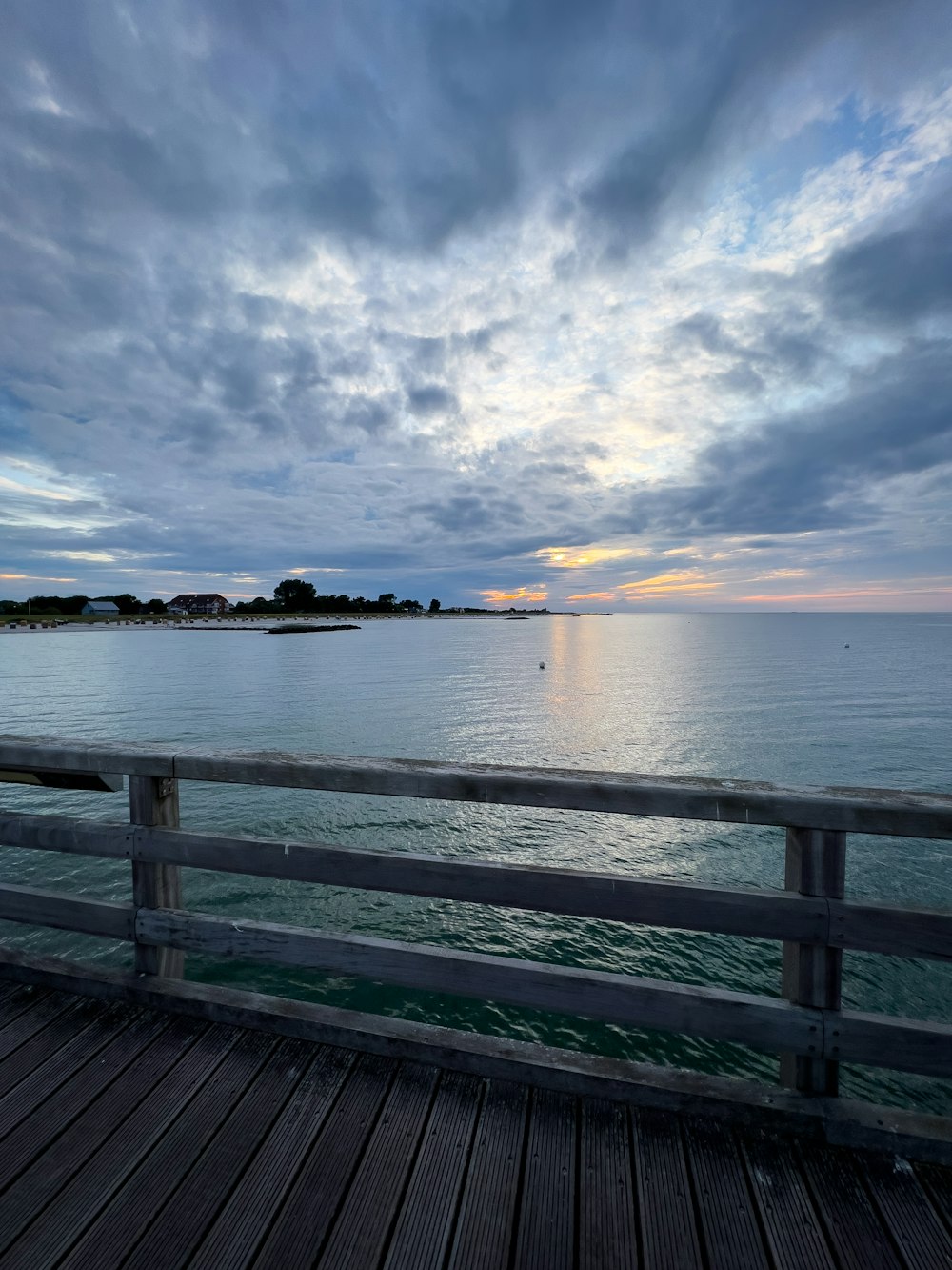 a pier with a bench on the side of it