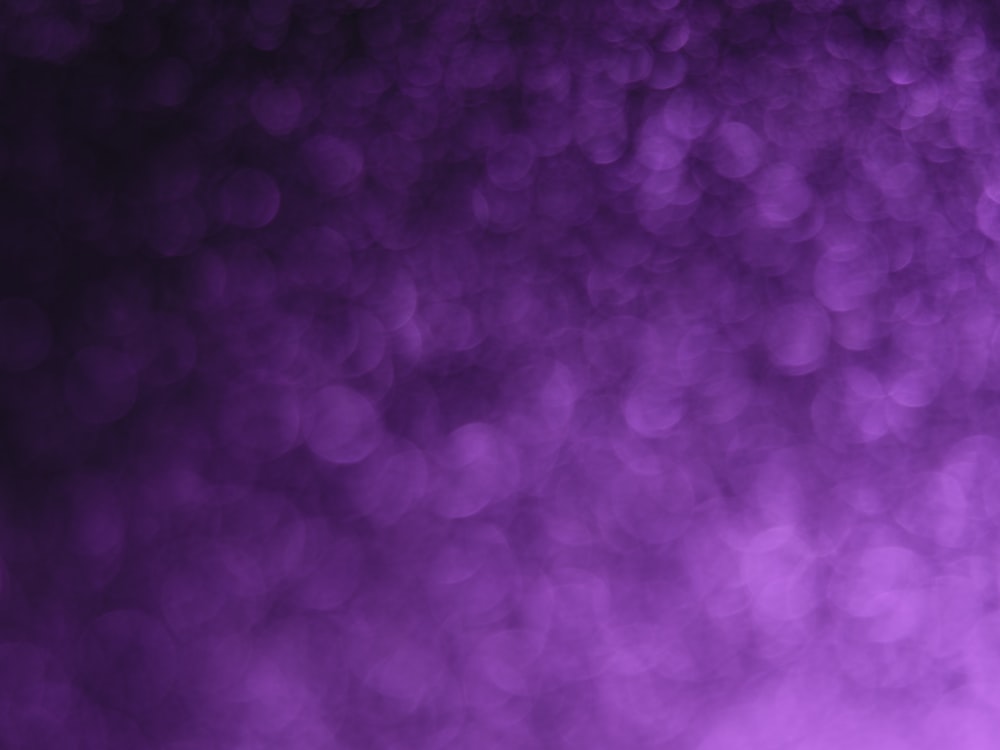 a blurry photo of a purple background