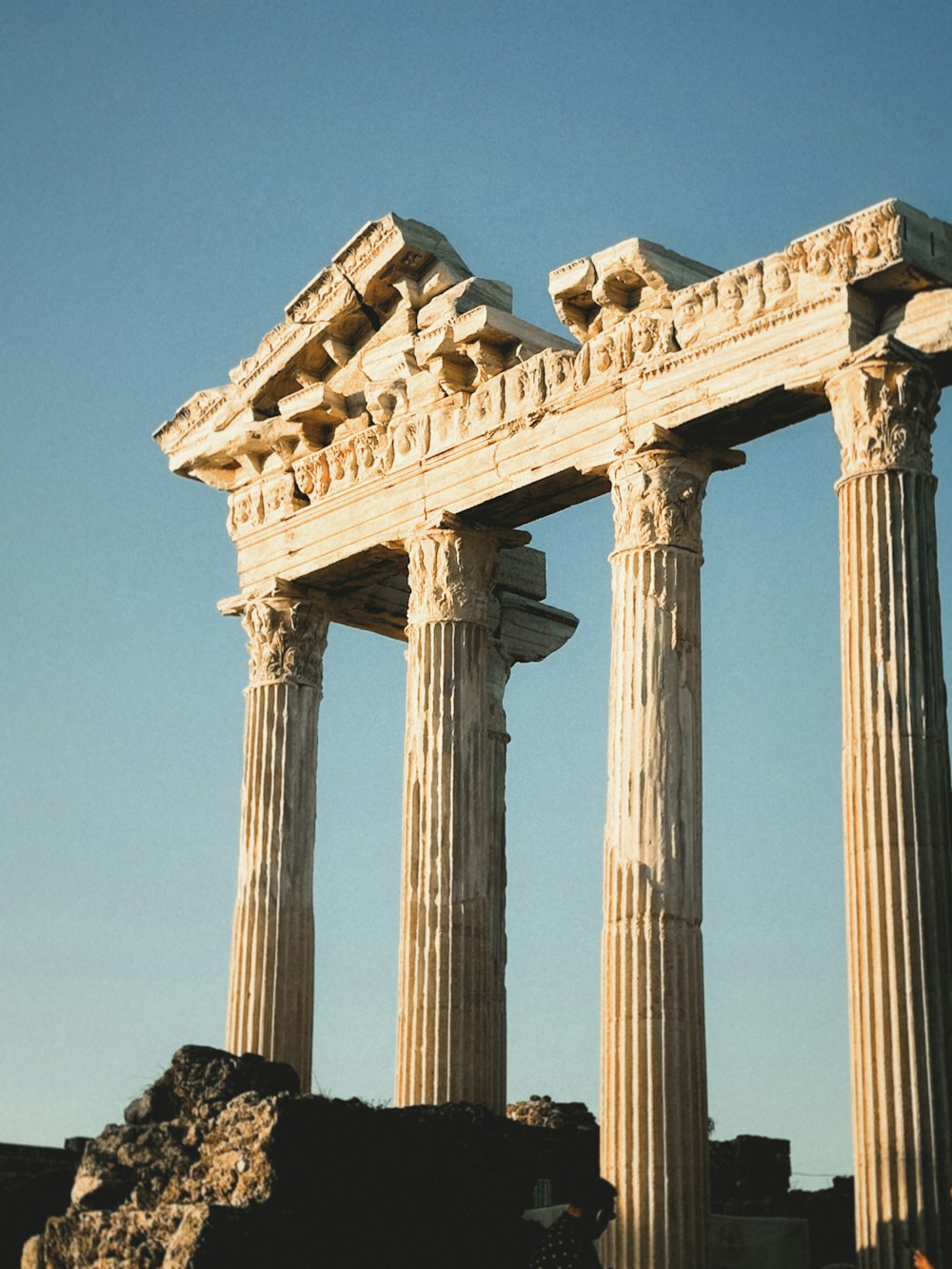 a couple of tall white pillars sitting next to each other