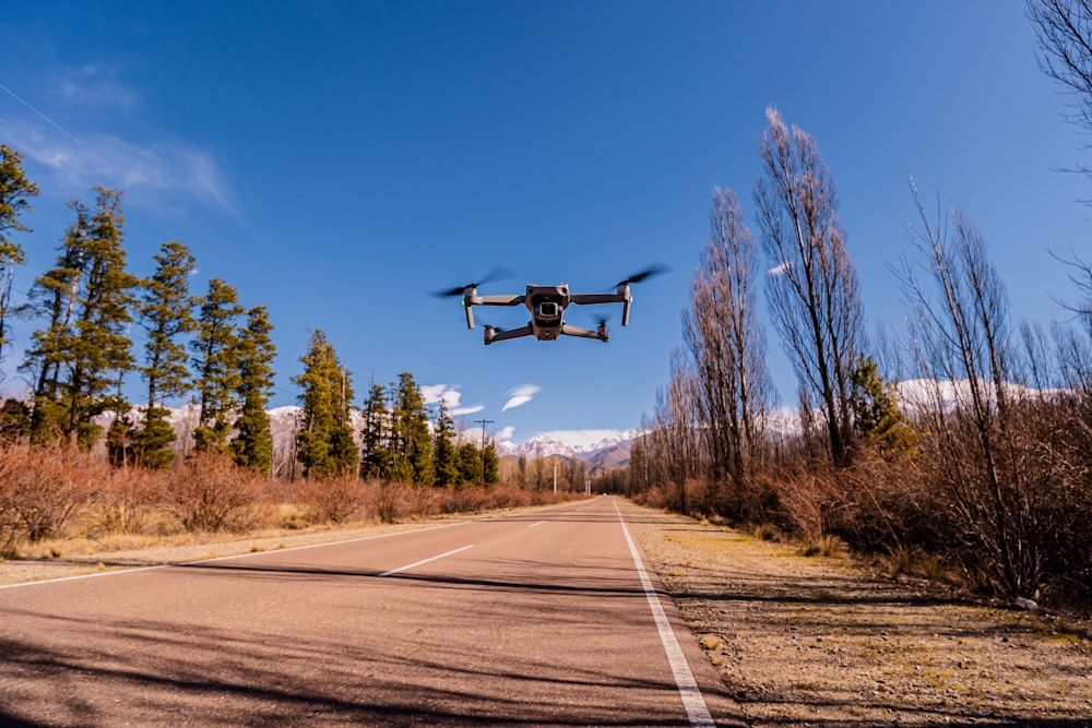 a large remote controlled flying over a road
