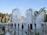 A vibrant water park scene with families enjoying various water attractions.