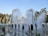 A vibrant water park scene with families enjoying various water attractions.