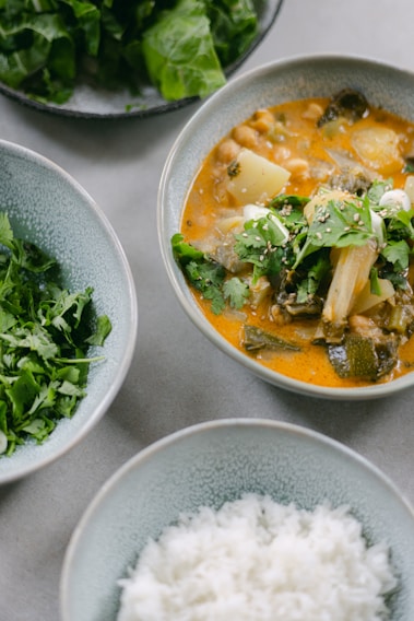 A close-up of a healthy meal with fresh vegetables and grains.