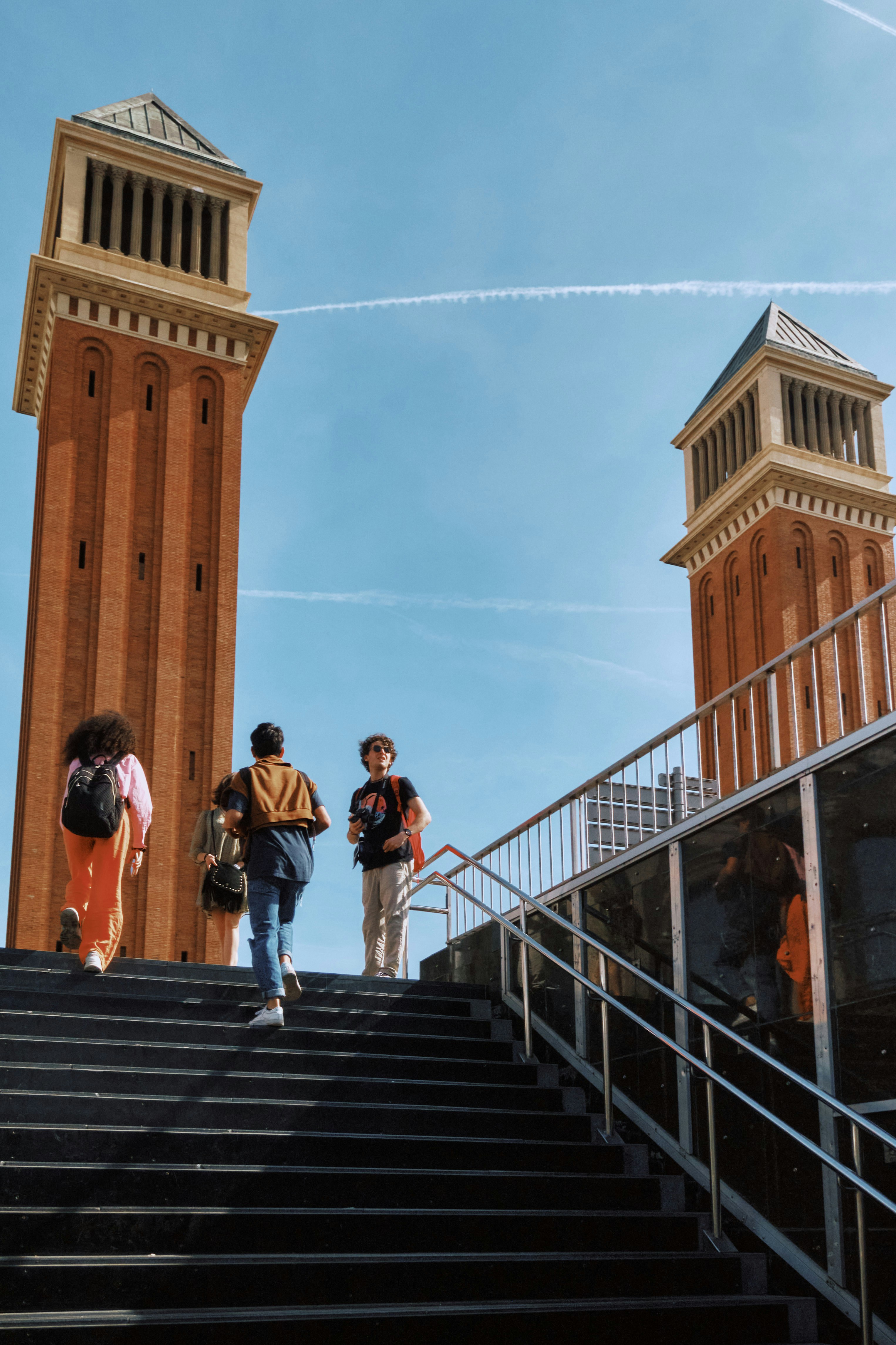 A group of people walking up a flight of stairs photo – Free Bell tower ...
