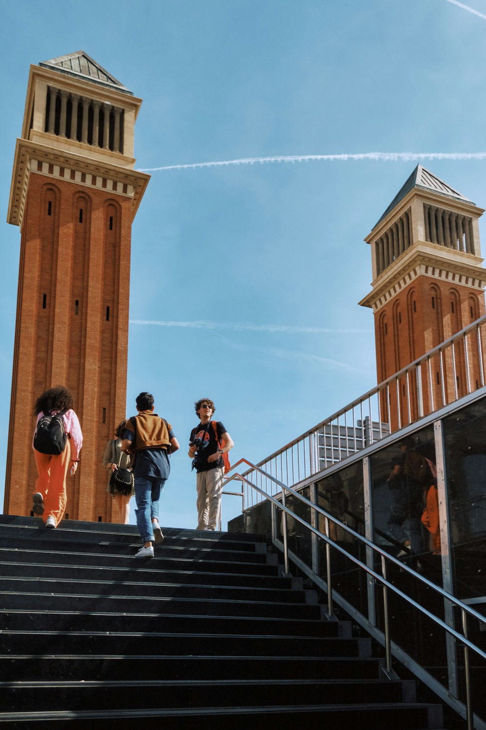 a group of people walking up a flight of stairs