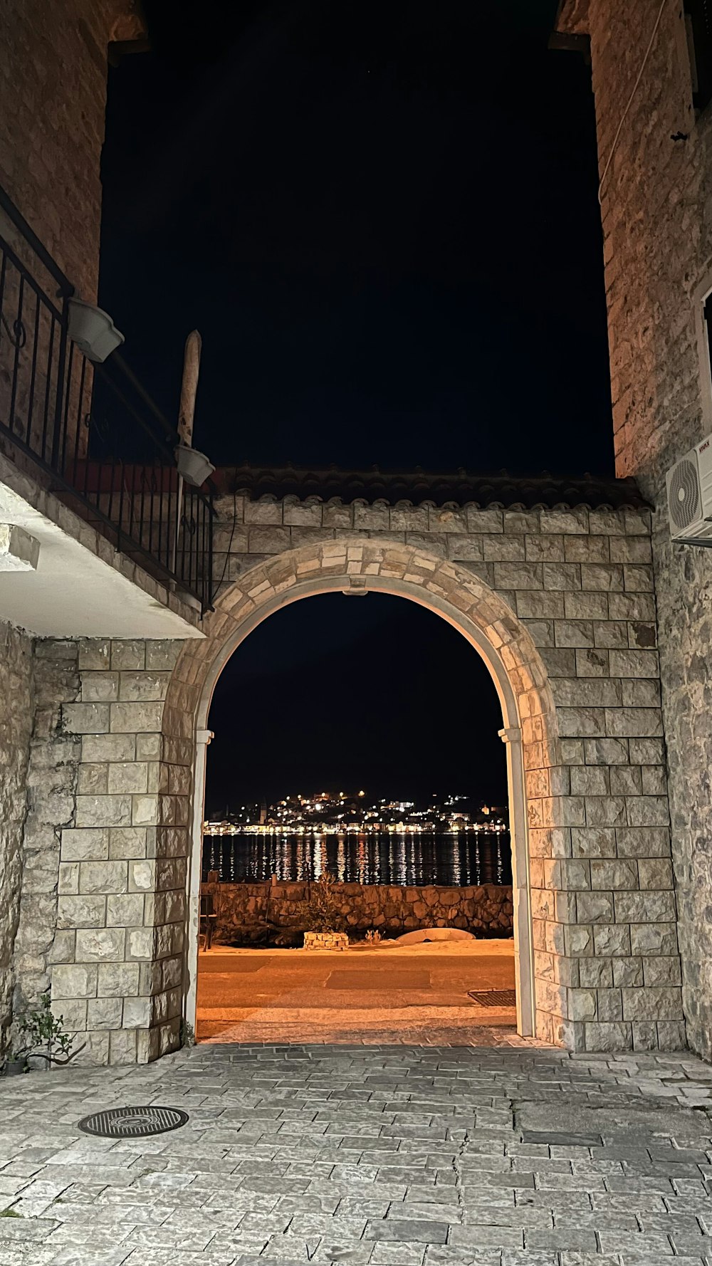 an open door to a building with a view of a city