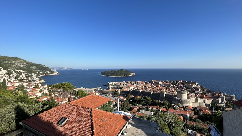 a view of a town and a body of water