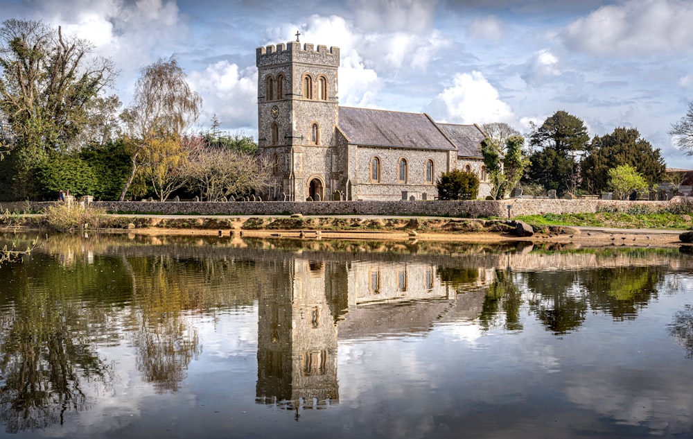 a large building sitting next to a body of water