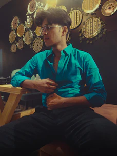 A compassionate advocate listening attentively to a neurodivergent individual in a cozy, welcoming room.