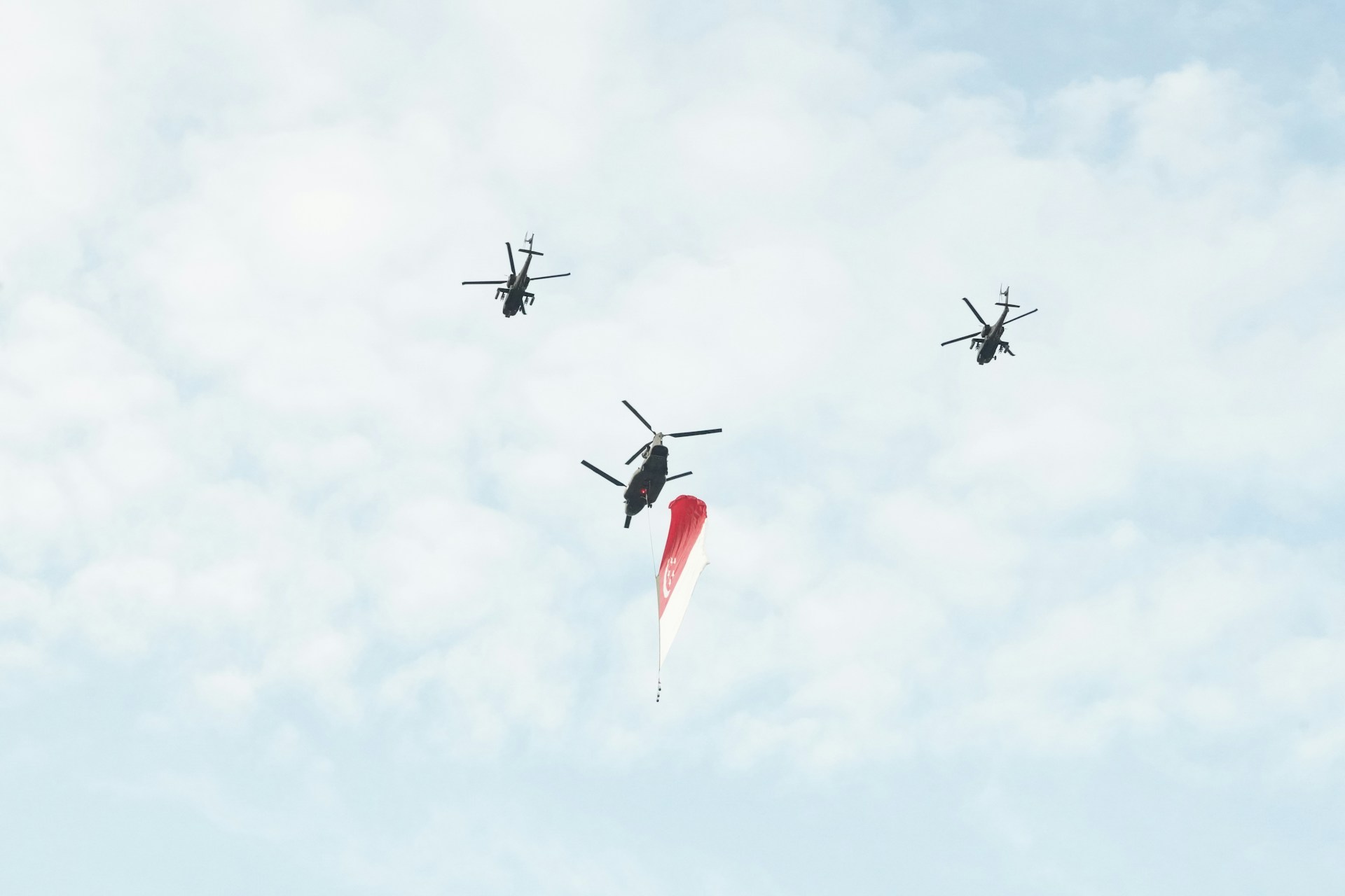 woman wearing yellow long-sleeved dress under white clouds and blue sky during daytime