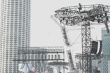A wide shot of a metal structure being assembled at a concert.